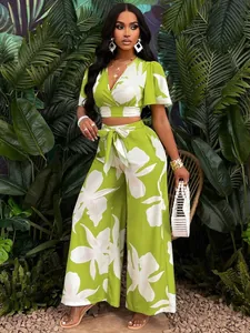 Chic tropical floral print two-piece set featuring butterfly sleeve top and wide-leg pants