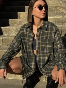 Oversized green plaid shirt for women featuring a retro American style and front pocket