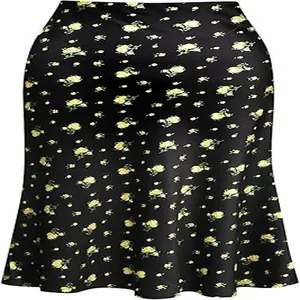 Close-up detail of high waist black satin fishtail skirt with yellow floral print