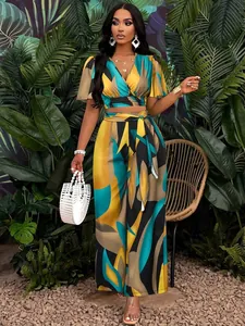 Full-length view of a women's tropical print set featuring butterfly sleeves and wide-leg pants
