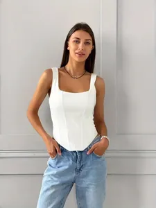 Close-up detail of a white square-neck corset tank top with elegant boning structure