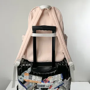 Light pink large capacity student backpack with luggage trolley sleeve for travel
