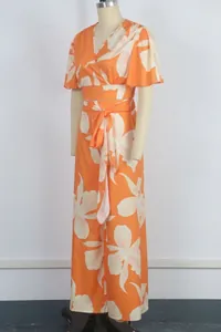 Women's two-piece set with tropical floral print, butterfly sleeve top, and wide-leg pants