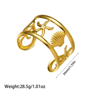 Detail showing measurements of the gold stainless steel starfish and shell cuff.