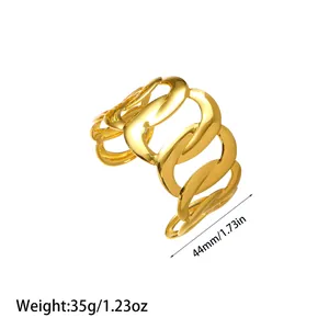 Macro view showing width and weight of minimalist golden titanium steel cuff bracelet