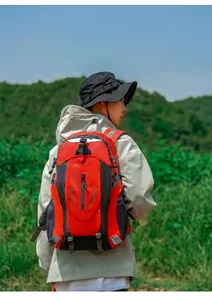 Model wearing a 40L orange water-repellent outdoor hiking backpack.