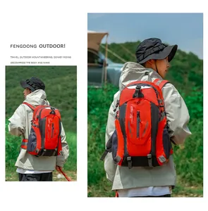 Large capacity red and black outdoor hiking backpack shown in a scenic mountain setting