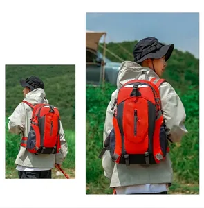 Large capacity red and black outdoor hiking backpack shown in a scenic mountain setting