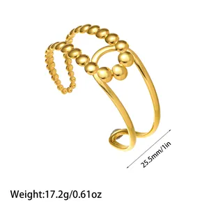 Detailed view of minimalist gold beaded stainless steel open cuff bracelet with size info