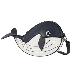 Side view detail of a cute cartoon whale-shaped crossbody bag with blue and white colors