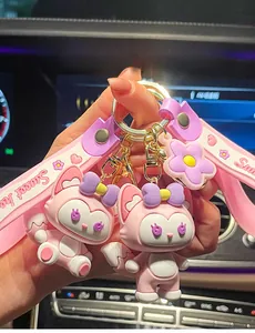Detailed view of two cute pink fox character keychains featuring decorative 'Sweet heart' straps.