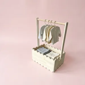 Wooden baby clothes rack with storage basket and hangers for nursery decor