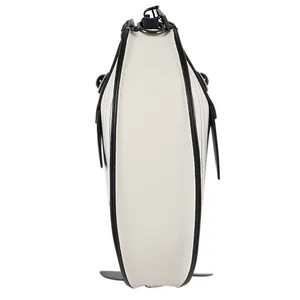 Side profile detail of the white whale-shaped cartoon crossbody bag with black trim