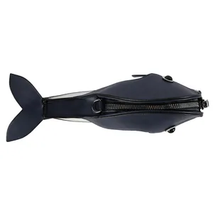 Top view of whale-shaped crossbody bag showing zipper closure and navy blue texture