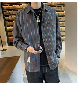 Detailed view of a trendy grey striped long-sleeve shirt for men in a library setting.