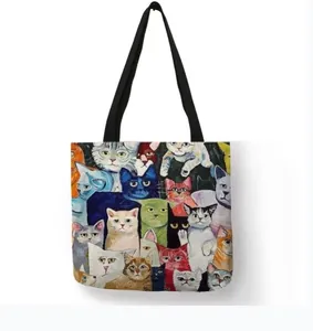 Detailed view of eco-friendly linen shopping bag featuring colorful cat illustration print