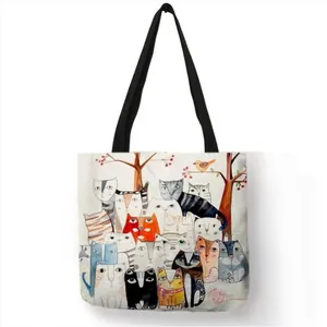 Eco-friendly linen tote bag with artistic watercolor cat illustrations and black handles