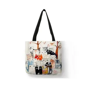 Artistic watercolor cat print linen shopping bag with black straps on white background