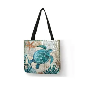 Detailed view of the sea turtle and starfish print on a durable linen shopping tote bag