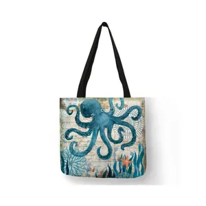 Close-up of eco-friendly linen shopping bag with vintage blue octopus and coral print.