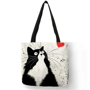 Eco-friendly linen tote bag with artistic tuxedo cat print and red heart design