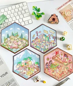 Detailed view of four hexagonal 2.5D 3D layered scene stickers for DIY scrapbooking