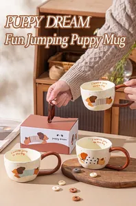 Handcrafted ceramic mugs featuring cute cartoon puppy illustrations and gift box