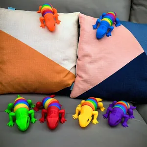 Colorful articulated rainbow lizard fidget toys for stress relief in a home setting
