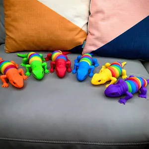 Close-up of rainbow articulated plastic lizard stress relief toys in various colors.