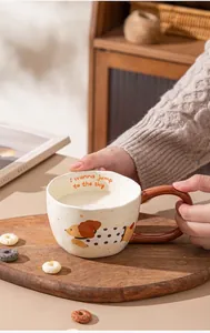 Close-up of a cartoon dog ceramic mug with milk, featuring microwave safe ceramic material