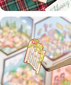 Close-up of a 2.5D floral gate sticker held by tweezers for DIY journals