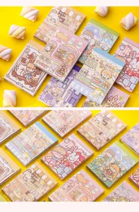 Detailed view of colorful cartoon mini notepads with cute character illustrations