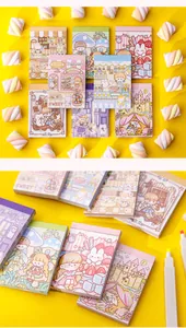 Detail view of cute cartoon mini memo pads with pastel illustrations on yellow background