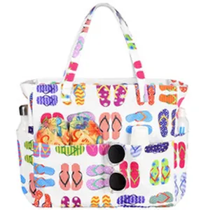 Detailed view of spacious beach tote with colorful flip-flop print and pockets