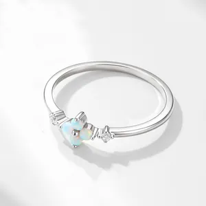 Elegant S925 sterling silver flower ring with white opals in a four-leaf clover design.