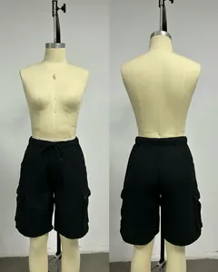 Front and back view of women's black cargo shorts with drawstring waist and large pockets