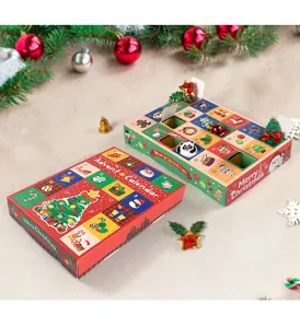 Detailed view of two 24-grid Christmas advent calendar boxes with festive holiday decorations.
