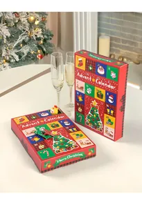 Two festive Christmas advent calendar boxes with 24 grids on a white table setting