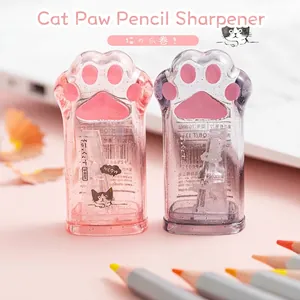 Close-up detail of cute cat paw-shaped pencil sharpeners in vibrant pink and purple colors