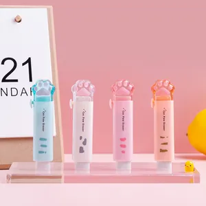 Four cute cat paw shaped retractable erasers in pastel colors displayed on a stand