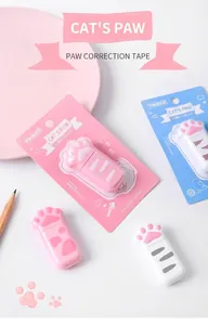 Close-up of cute cat paw shaped correction tapes in pink and white retail packaging
