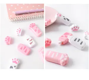 Close-up detail of cute pink and white cat paw shaped correction tapes