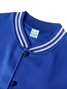 Detail of blue varsity jacket collar with care label showing material composition.