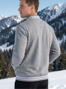 Men's gray fleece baseball jacket and black pants set shown in a snowy landscape.