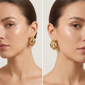 Professional studio shot of gold-plated triple hoop C-shaped earrings for women