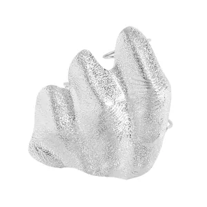 Detailed macro shot of an artistic irregular silver pleated knuckle ring for women.