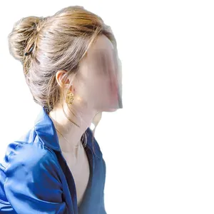 Elegant retro golden round hoop earrings worn by model with blue silk shirt outfit