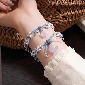 Resin woven bracelet with star and moon charms, featuring colorful flower beads