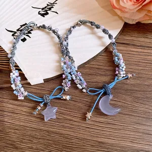 Handmade woven resin flower bracelets with star and moon pendants in blue and purple