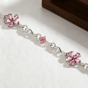Macro view of delicate pink flower crystal bracelet with elegant silver finish